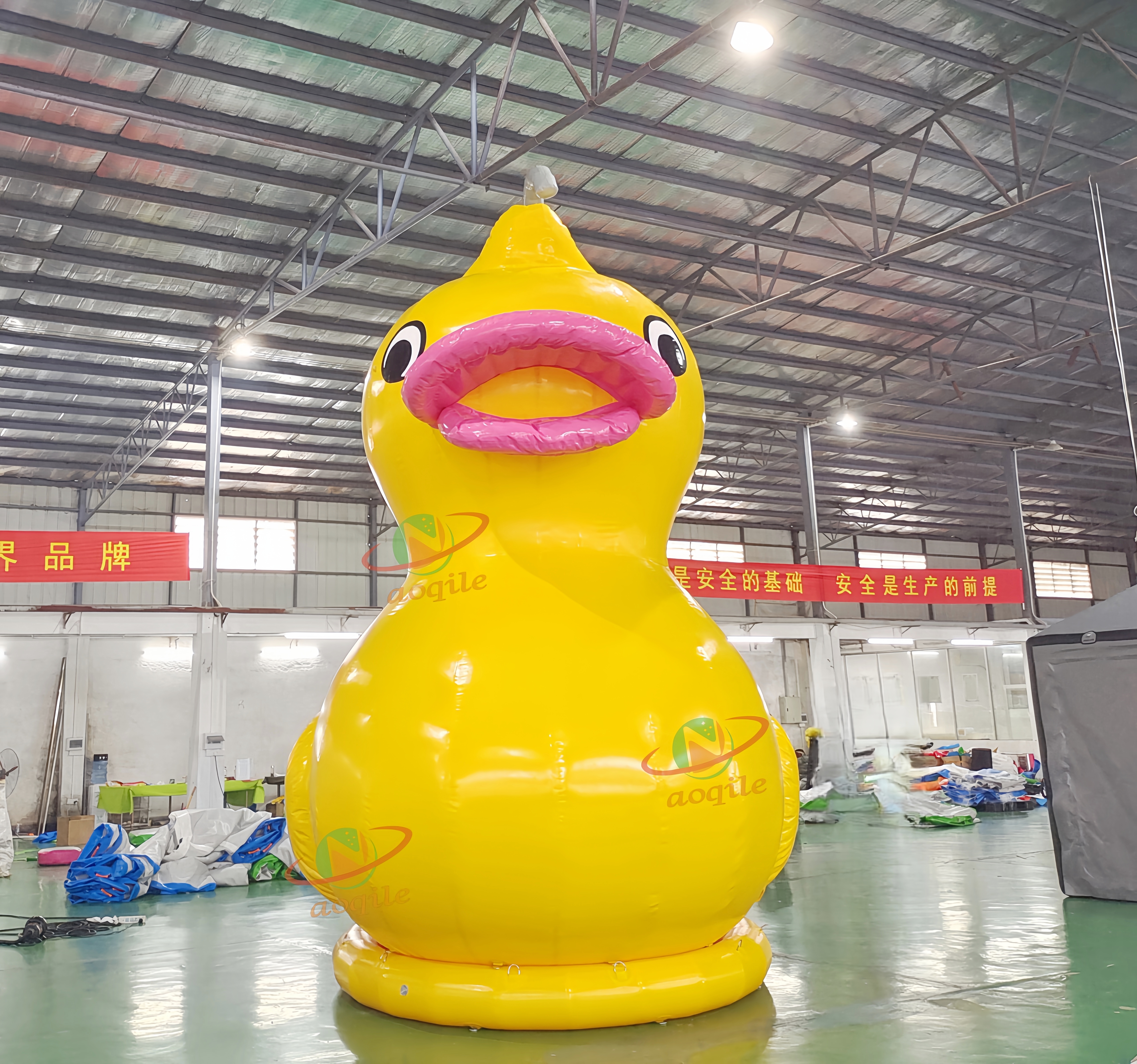 Advertising yellow giant inflatable duck inflatable rubber duck in the lake or land for propaganda